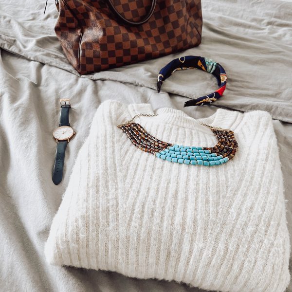 Statement necklace on a white sweater