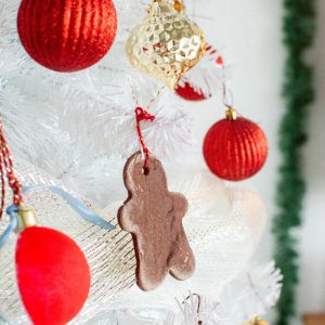 Make your very own gingerbread cookies ornaments with an easy-to-follow cinnamon salt dough recipe that will make your home smell cozy and warm for the holiday season.